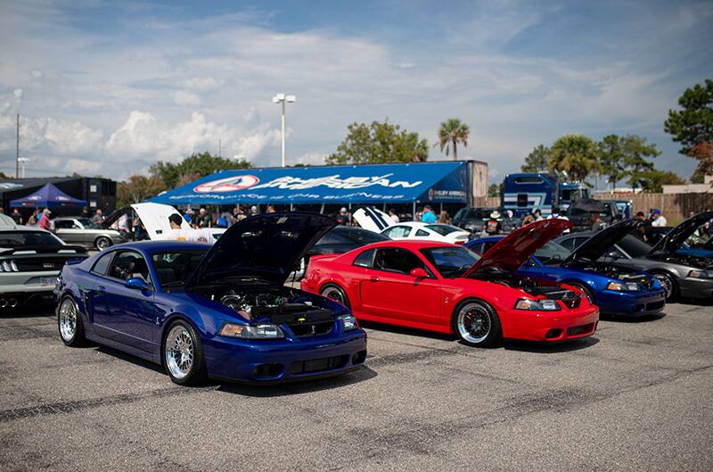 Red and Blue Terminator Cobras parked at Mustang Week Show